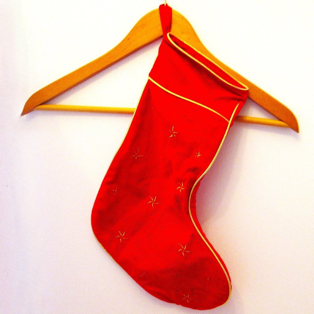 Red & gold piping and stars velveteen lined Christmas stuffing stocking.